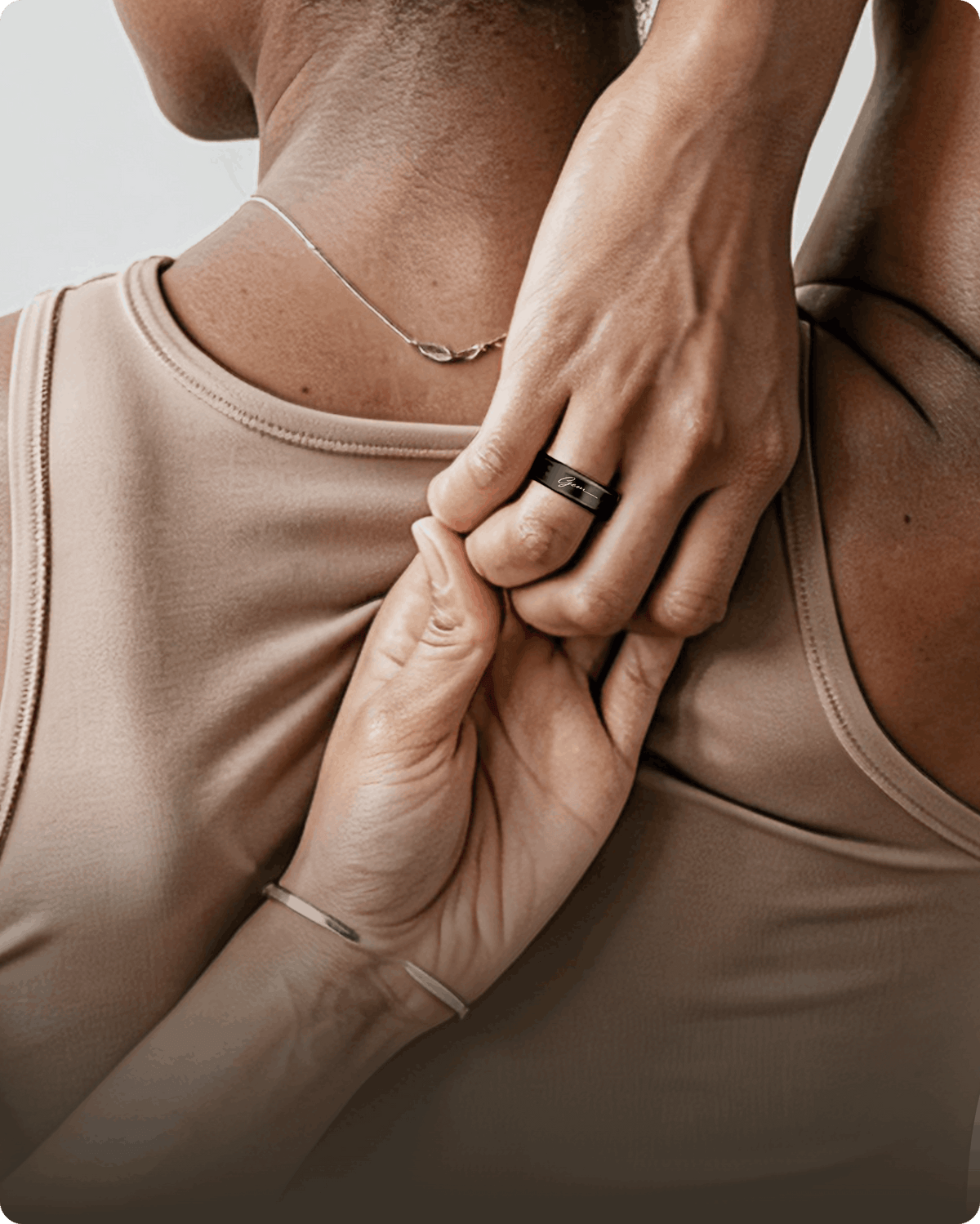 Woman wearing GemRing smart ring to track cycle and women's health